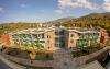 Curved green roof and green facades on a large building